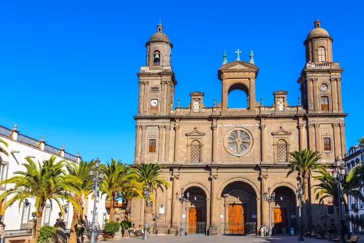 Cathedral of Santa Ana facade with palm trees in Plaza de Santa Ana, Las Palmas de Gran Canaria