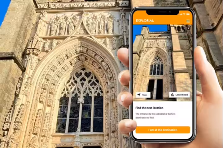 Phone app guiding Lausanne Cathedral stop on Lausanne city center scavenger hunt and sights self-guided tour