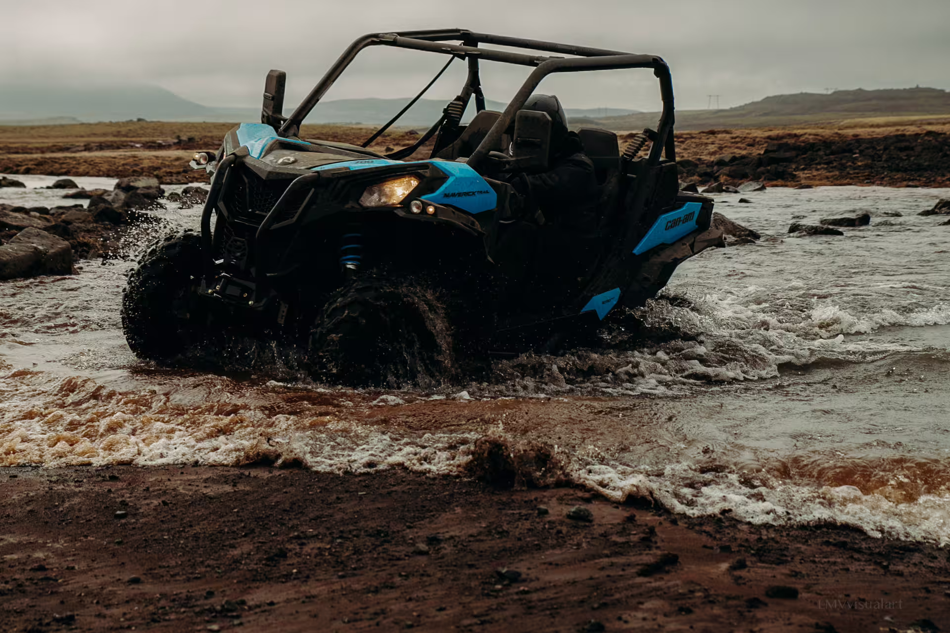 Off-road buggy splashes through rugged lava field terrain, offering an exhilarating 2-hour adventure experience.