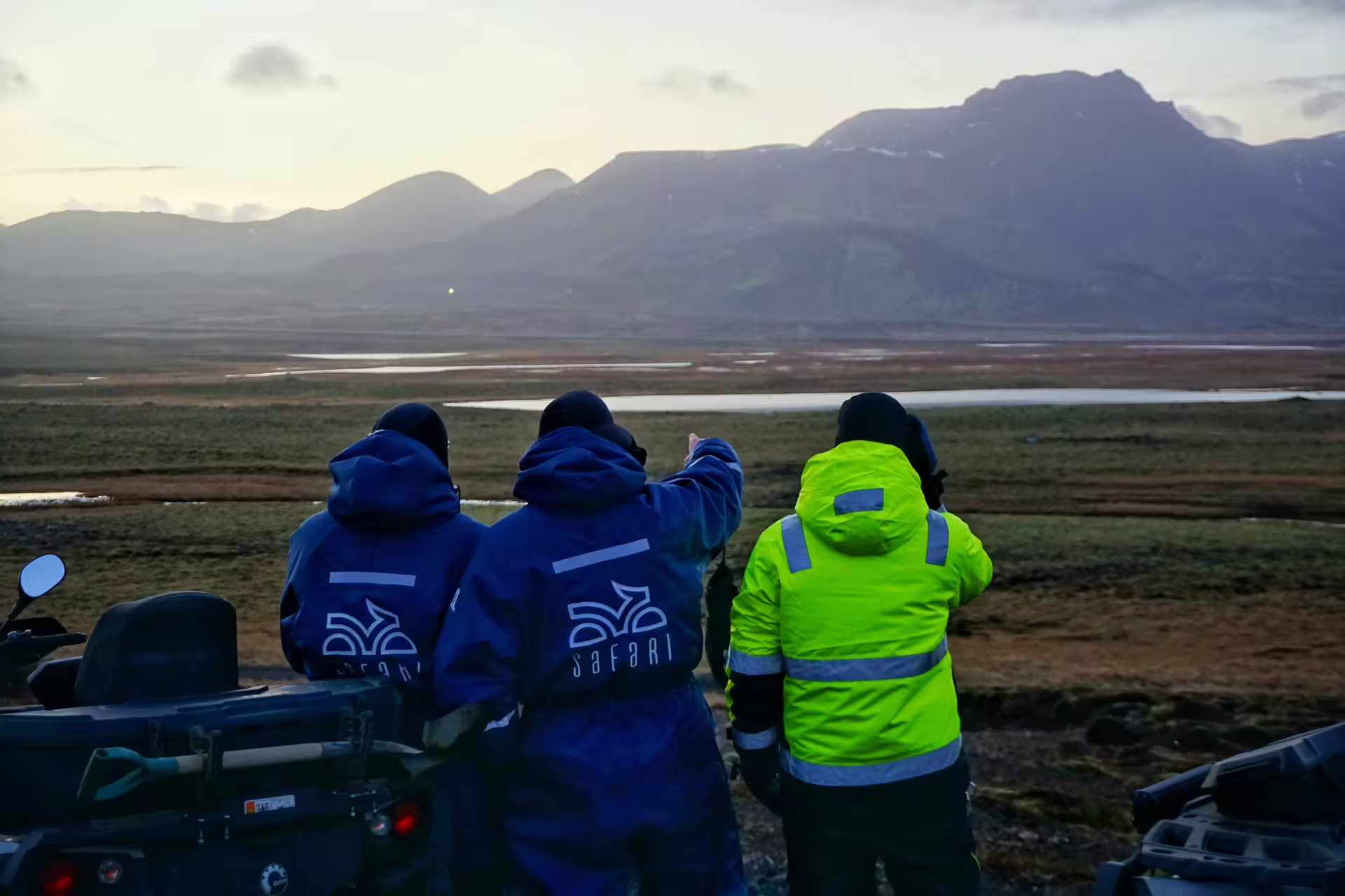 Adventurers in warm gear explore a scenic lava field landscape during a thrilling 2-hour buggy tour at dusk.