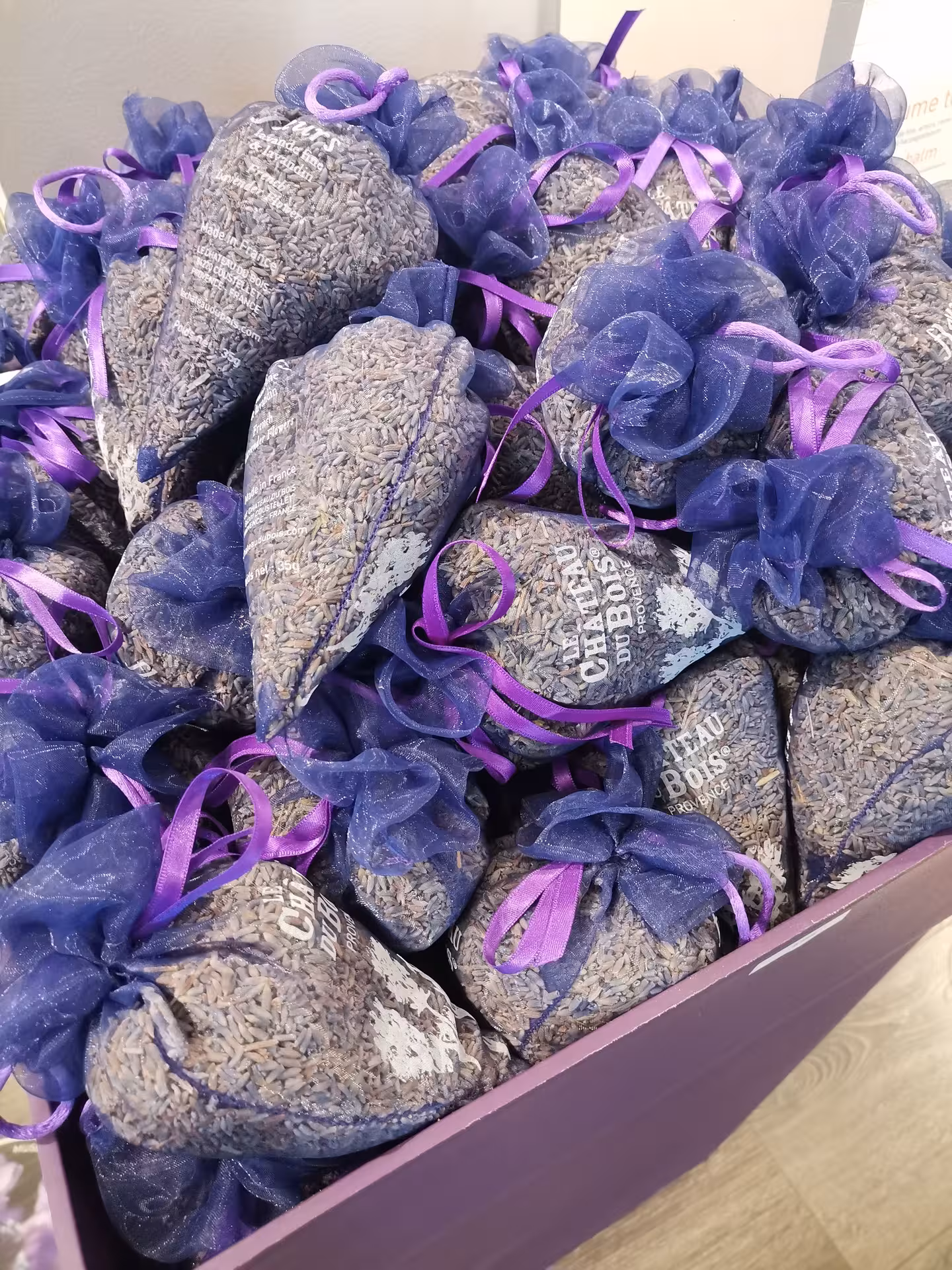 Lavender sachet gifts with purple ribbons, authentic Provence lavender field experience souvenir for visitors