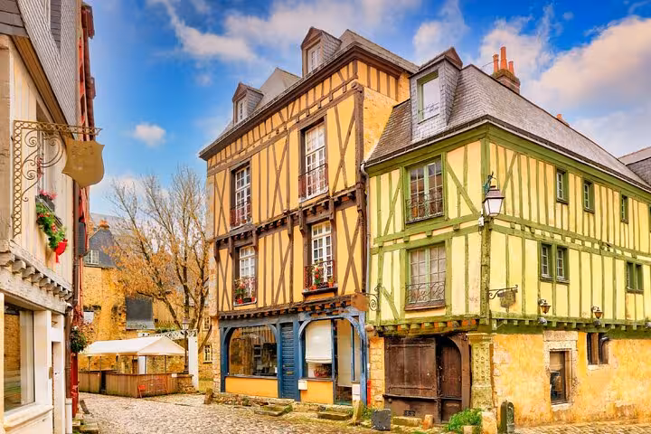 Historic half-timbered buildings on cobblestone street in Le Mans old town, France