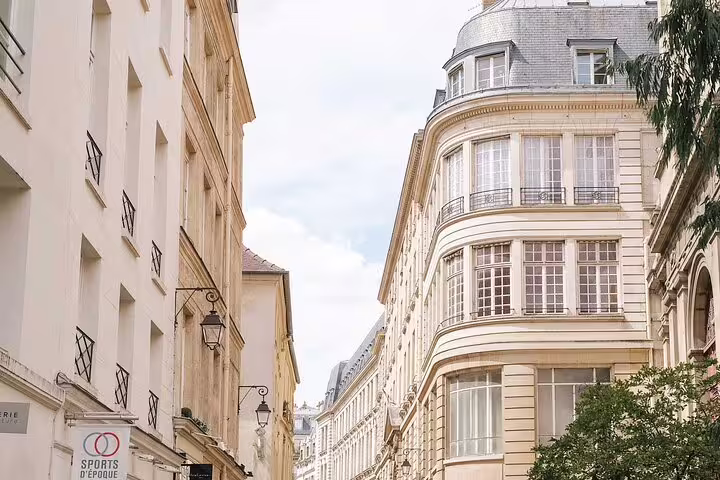 Elegant Haussmann buildings lining a narrow street in Le Marais neighborhood, Paris