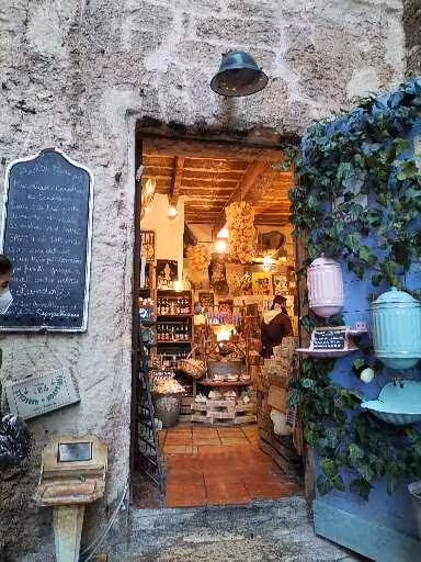 Rustic artisan shop doorway in Le Panier, Marseille old town, on a guided walking tour with local crafts