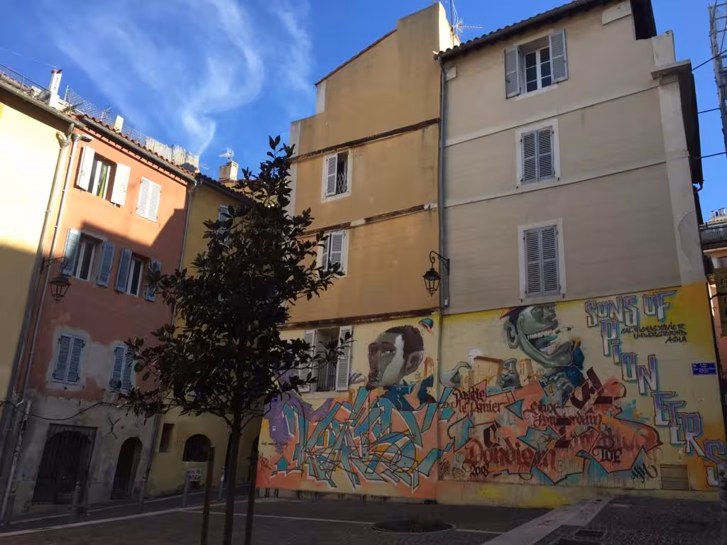 Colorful murals and pastel buildings in Le Panier, Marseille, on foot tour exploring the city’s oldest neighborhood