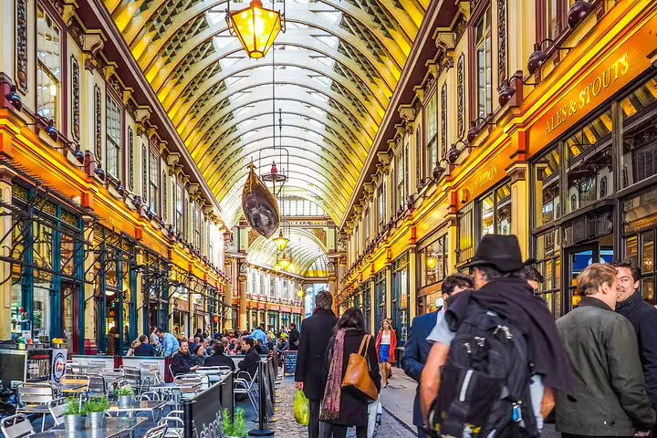 Vibrant Leadenhall Market in London bustling with tourists and locals, showcasing historic architecture and lively atmosphere.