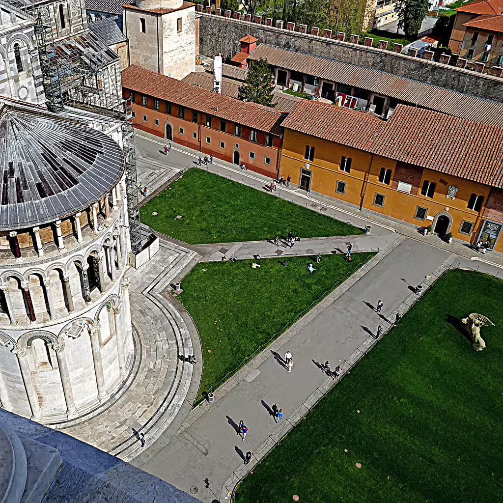 Aerial view from the Leaning Tower of Pisa over Piazza dei Miracoli lawns on a Florence and Pisa day trip from Rome
