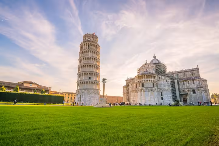 Leaning Tower of Pisa and Cathedral under vibrant sky on half-day tour from Florence.