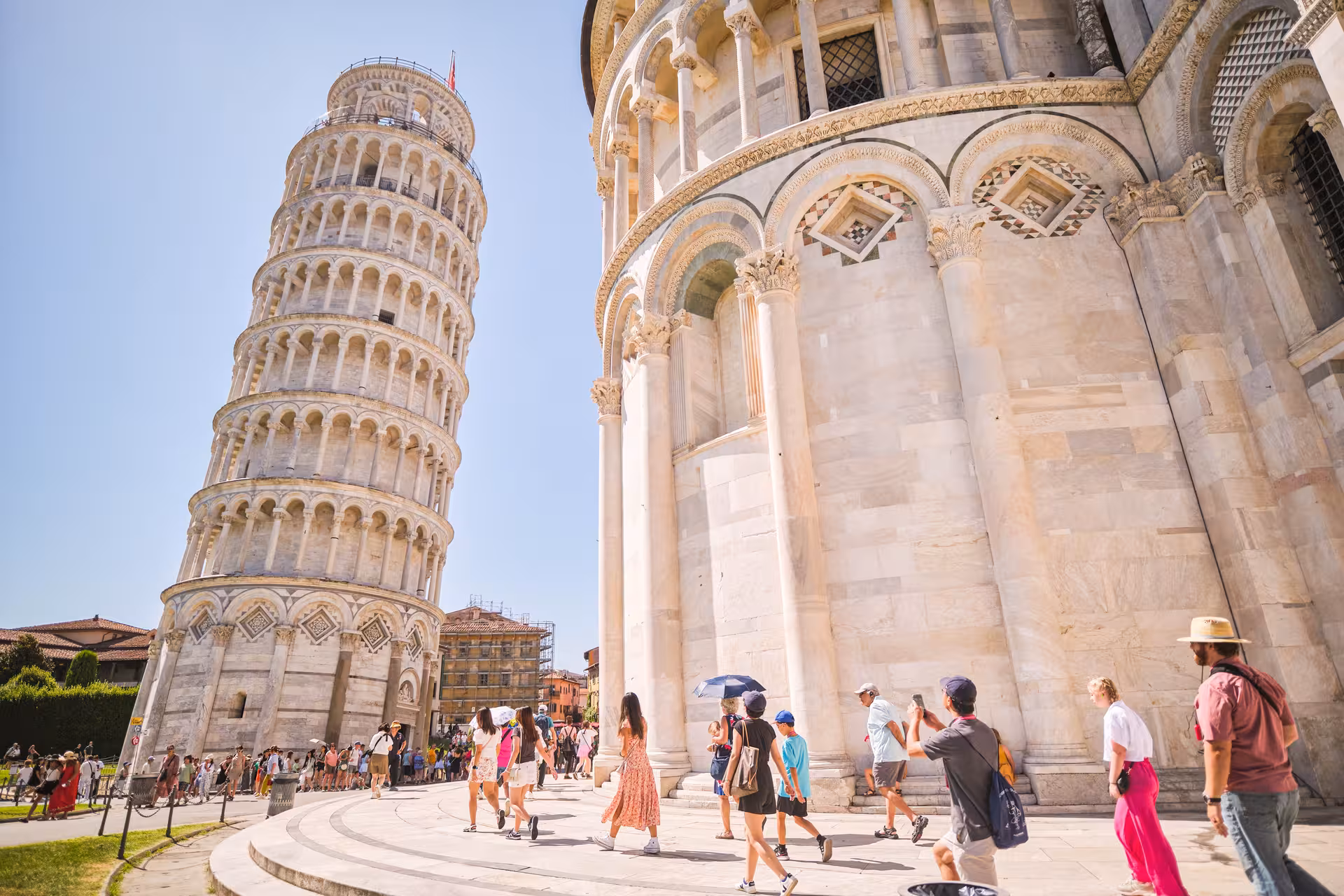 Tourists explore the iconic Leaning Tower of Pisa on a full day shore excursion from Livorno.