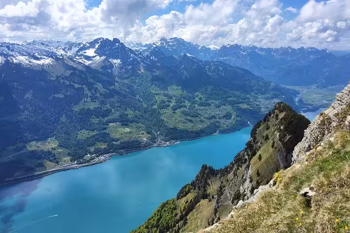 Leistkamm Ridge trail viewpoint above Walensee, dramatic cliffs and Swiss Alps on a Zurich day hike