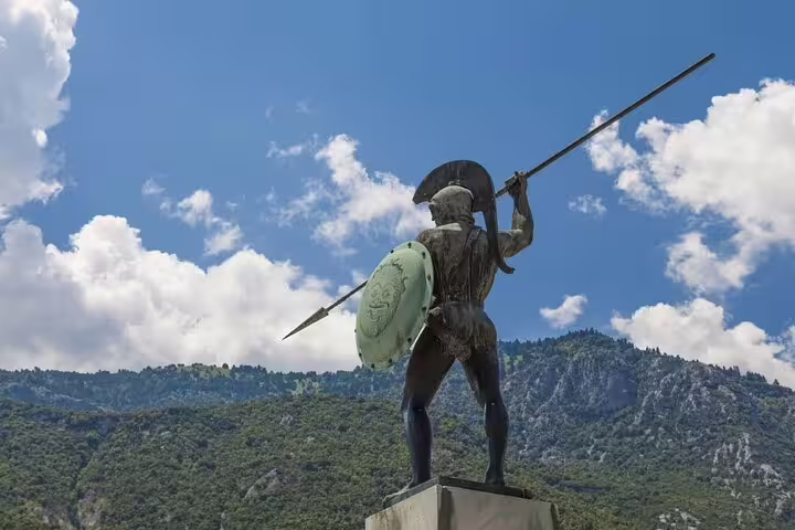 Leonidas Monument with mountains and clouds near Thermopylae on Meteora private day tour from Athens