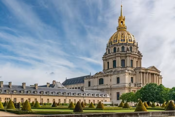 Les Invalides golden dome and manicured gardens in Paris, France