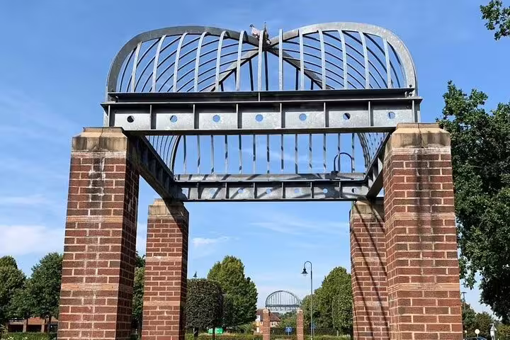 Metal heart sculpture gate with brick pillars at Letchworth Garden City park