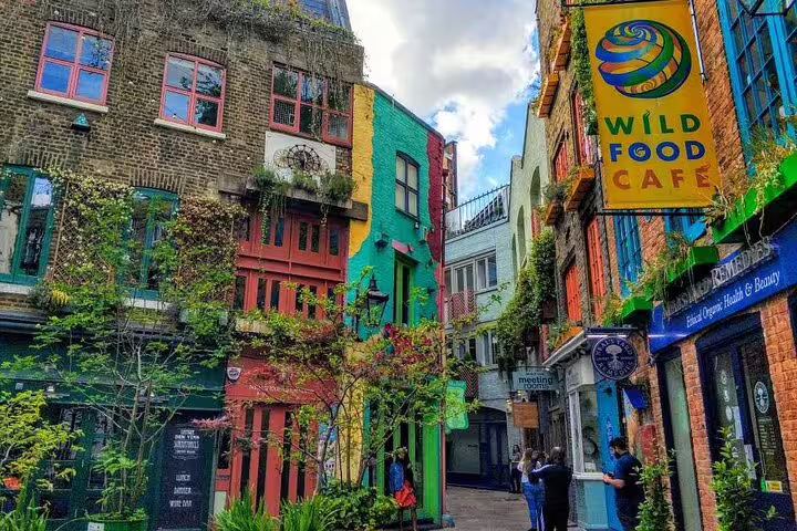 Colorful buildings and shops on Neal's Yard alleyway in London's Covent Garden