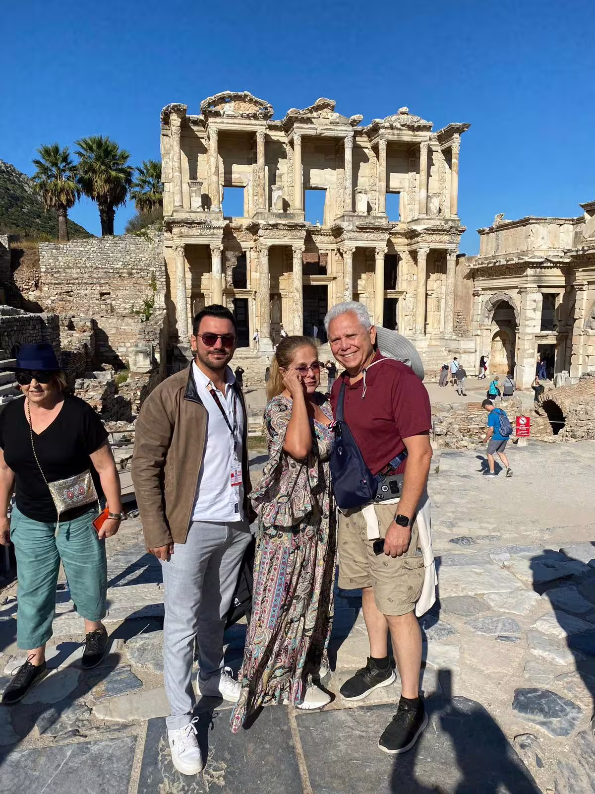 Visitors posing by the Library of Celsus in Ephesus, highlight of the Ephesus & Istanbul combined 2 tours