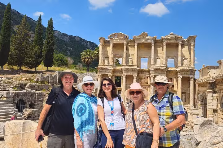 Travelers pose by the Library of Celsus in Ephesus on 3-day Istanbul to Ephesus Pamukkale Priene tour