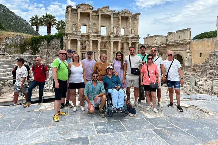 Visitors at Library of Celsus, Ephesus, enjoying a guided tour from Izmir Port in a historic setting.