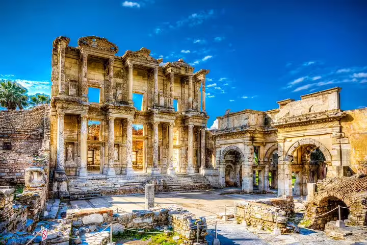 Stunning view of the ancient Library of Celsus in Ephesus under a clear blue sky, part of a private tour from Kusadasi Port.