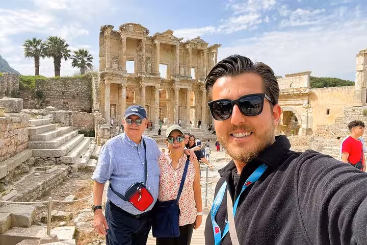 Travelers with guide at Library of Celsus, Ephesus on 2-day Ephesus & Pamukkale tour from Istanbul