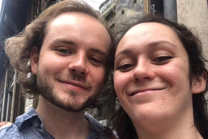 Couple selfie in Lille city center while joining a scavenger hunt walking tour to discover top highlights and sights