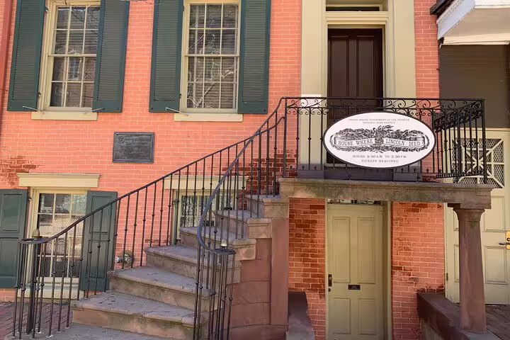 Historic Petersen House where Lincoln died, red brick building with iron staircase railing in Washington DC