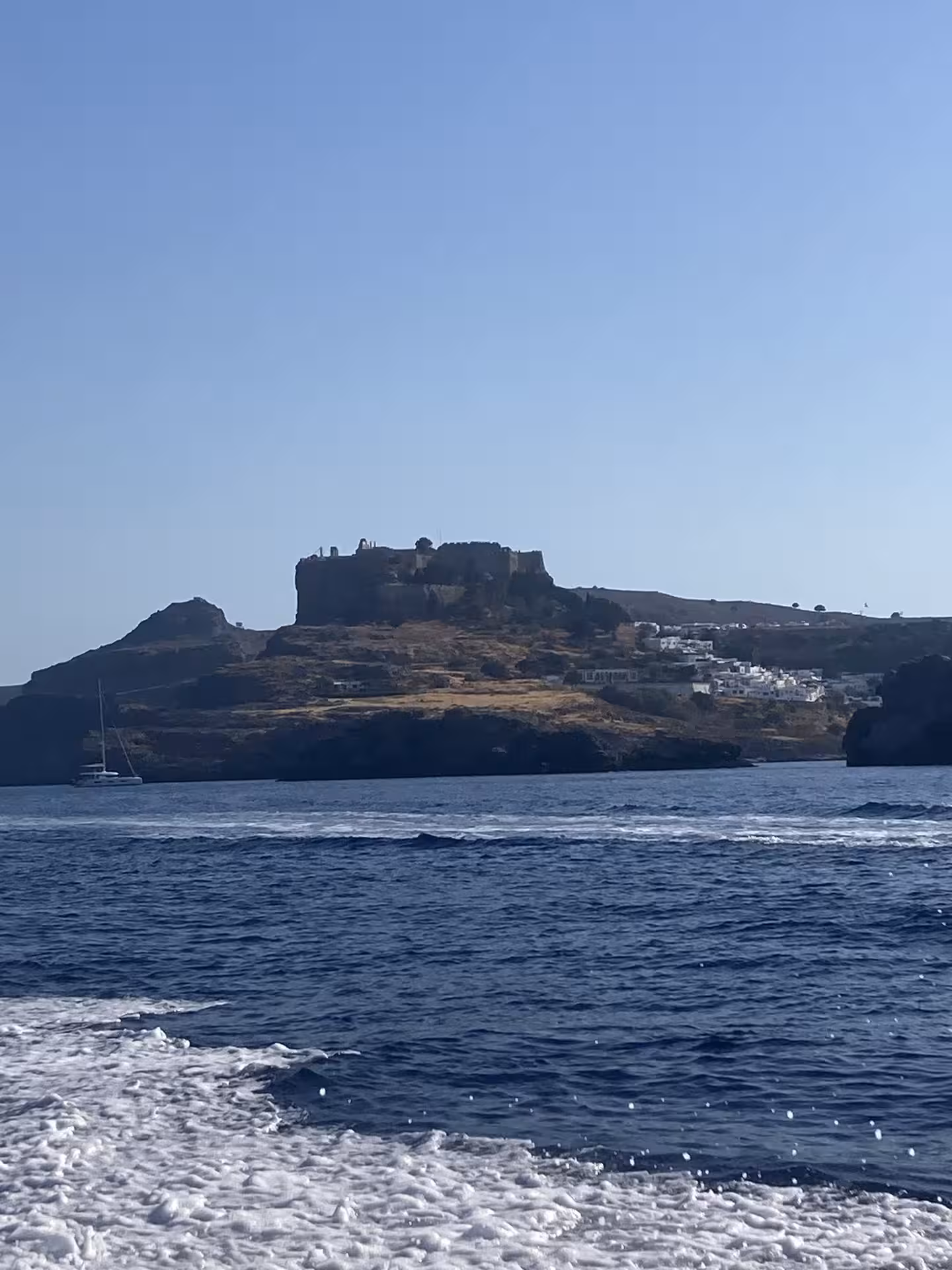 Lindos Acropolis and whitewashed village from the sea on Axopar 25 CT, Rhodes scenic boat tour