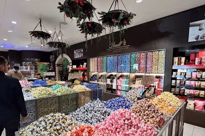 Lindt Home of Chocolate Zurich shop with colorful Lindor truffles, sweets display after museum visit