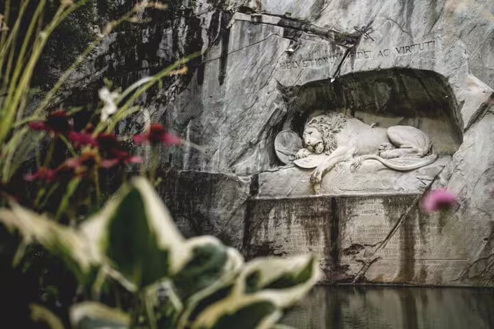 Lion Monument in Lucerne, a serene and historic sculpture, perfect for cultural exploration on a Mount Pilatus day trip.