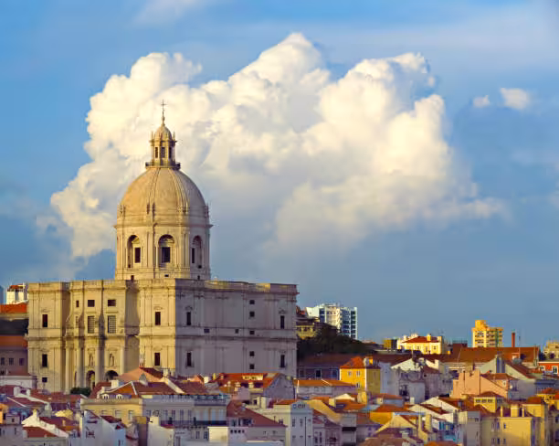 Panoramic view of Lisbon's iconic National Pantheon dome rising above colorful rooftops on an e-bike tour of 7 Hills
