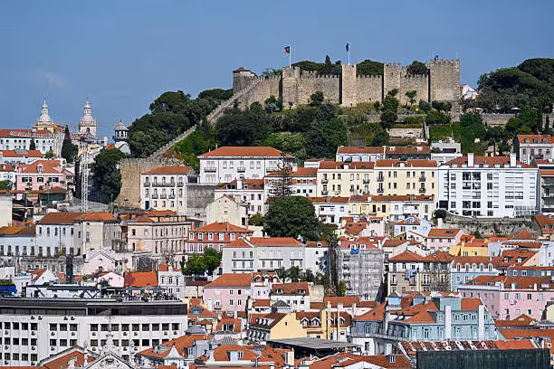 Aerial view of Lisbon 7 Hills with São Jorge Castle and colorful rooftops on the Lisbon e-bike tour