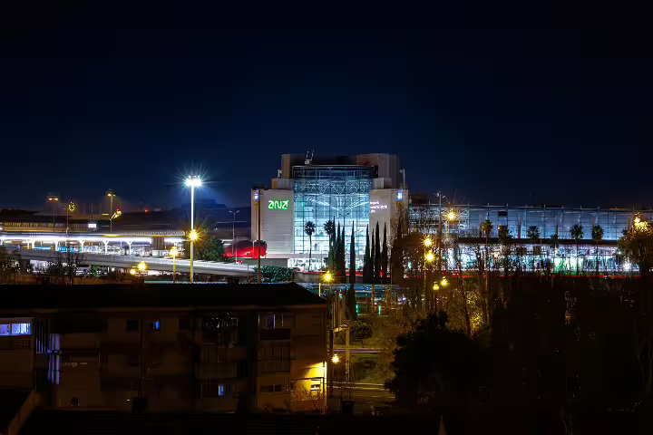Night view of Lisbon Airport "LIS", showcasing the vibrant cityscape ideal for transfers to Ericeira, Mafra, or Torres Vedras.