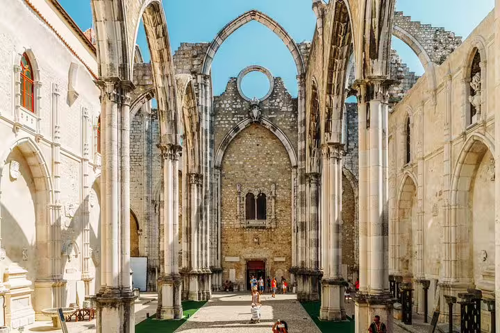 Explore Lisbon's historic Carmo Convent ruins on a full-day private tour, featuring unique architecture and a rich gastro experience.