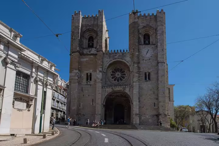 Discover the historic Lisbon Cathedral with its impressive Romanesque facade on a comprehensive small group city tour.