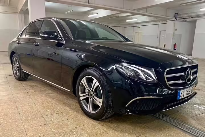 Luxury black sedan for private Lisbon to Douro Valley direct journey, offering comfort and style for scenic travel in Portugal.