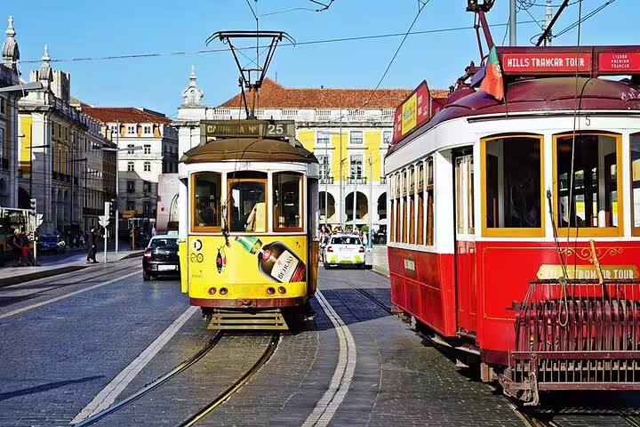 Historic trams navigating Lisbon's vibrant streets, a highlight of the Lisbon to Setúbal Peninsula Private Half-Day Tour.