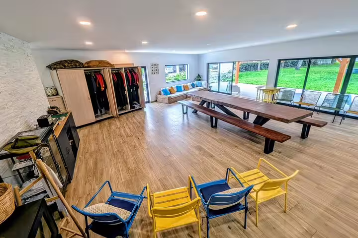 Spacious indoor area with seating and gear storage for Lisbon's kayak and coasteering adventure tour.