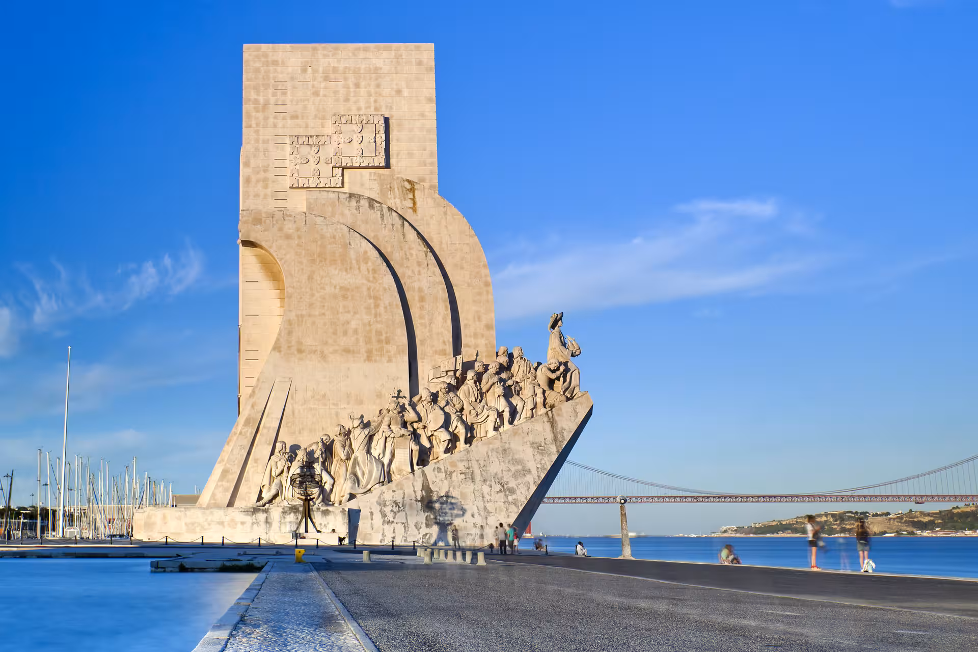 Explore the iconic Monument to the Discoveries in Belém, Lisbon on a sunny day with the Tagus River in view.