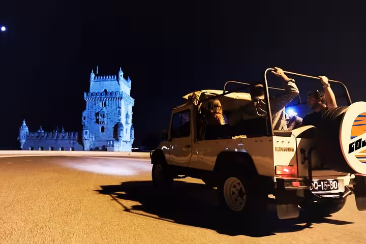 Vintage Jeep Lisbon night tour by Belém Tower, scenic evening ride with food and drink tasting