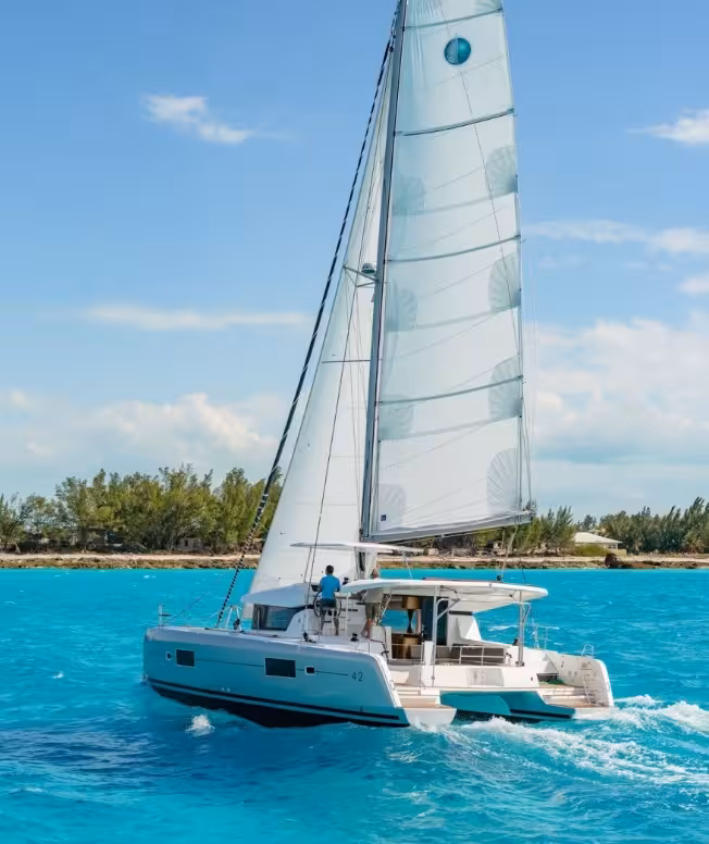 Modern sailing catamaran cruising on open water, ideal for Lisbon New Year’s Eve VIP catamaran tour