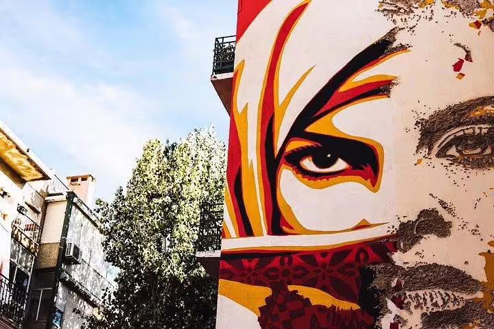 Discover vibrant street art in Lisbon's Old Town, a highlight of the tuk tuk tour showcasing urban creativity and culture.