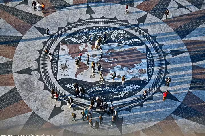 Aerial view of Lisbon's iconic compass rose at Padrão dos Descobrimentos, showcasing intricate design on a private city tour.
