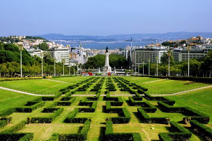 Lisbon panoramic view from Eduardo VII Park with lush greenery and cityscape, perfect for Old Town, New Town & Belem tour.