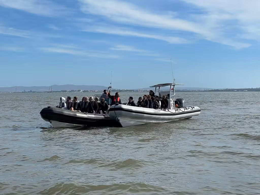 Two RIB boats with participants on the Tagus River for a Lisbon plastic pickup and boat tour with eco guide
