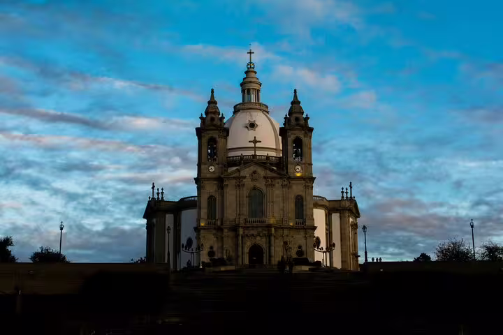 Majestic Sanctuary of Bom Jesus do Monte in Braga under a vivid sky, ideal for a stopover on a Lisbon to Porto tour.