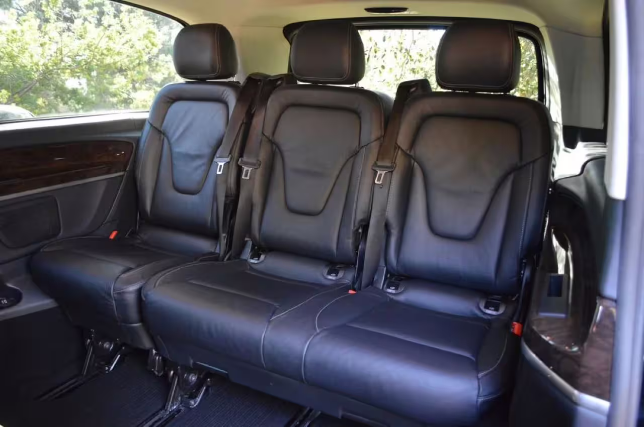 Spacious leather interior of van for comfortable Lisbon to Porto transfers with tourist stops.