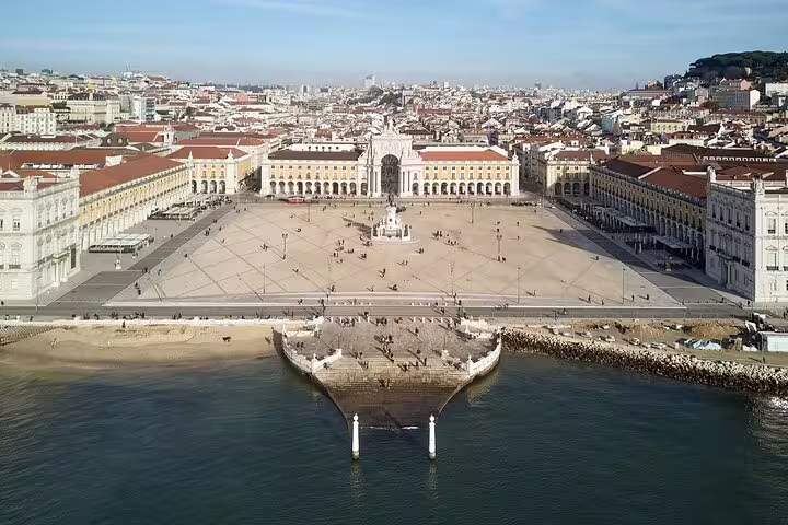 Aerial view of Lisbon's Praça do Comércio, showcasing historical architecture and vibrant cityscape, ideal for private tours.