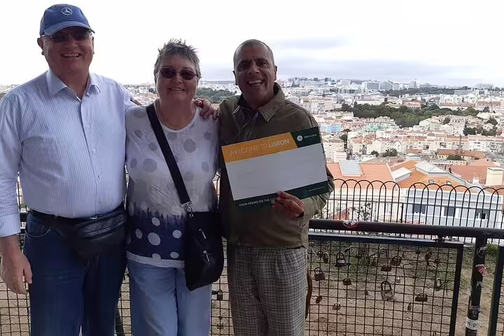 Guests with local guide at Lisbon viewpoint, private full-day tour to Fátima Nazaré and Óbidos