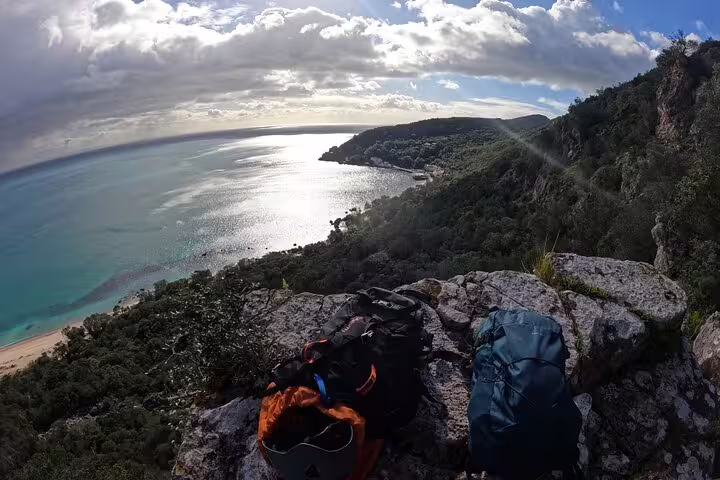 Breathtaking coastal view from a cliffside with climbing gear, showcasing the scenic beauty of Lisbon's adventure trails.
