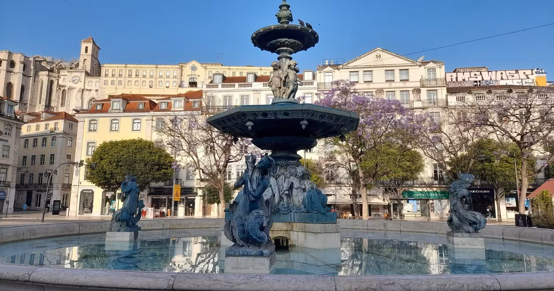 Lisbon Rossio Square fountain, scenic stop on 8-day Portugal food and wine tour with tastings and classes