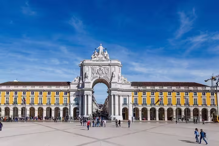 View of Lisbon's iconic Rua Augusta Arch in the historic city center, a highlight of the Lisboa Old Town tour.